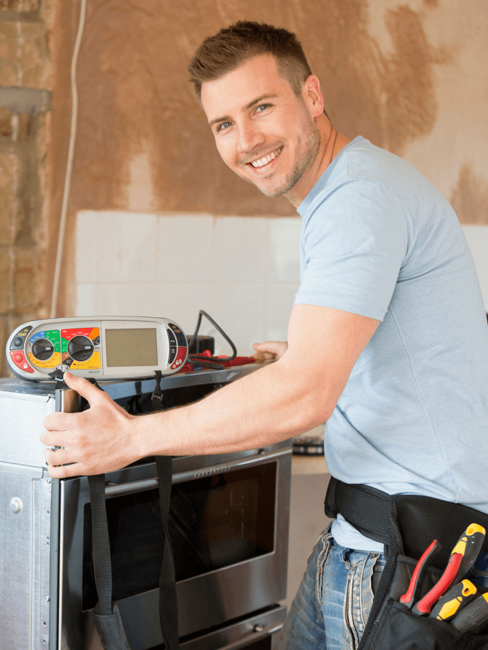 Professional technician working on appliance installation